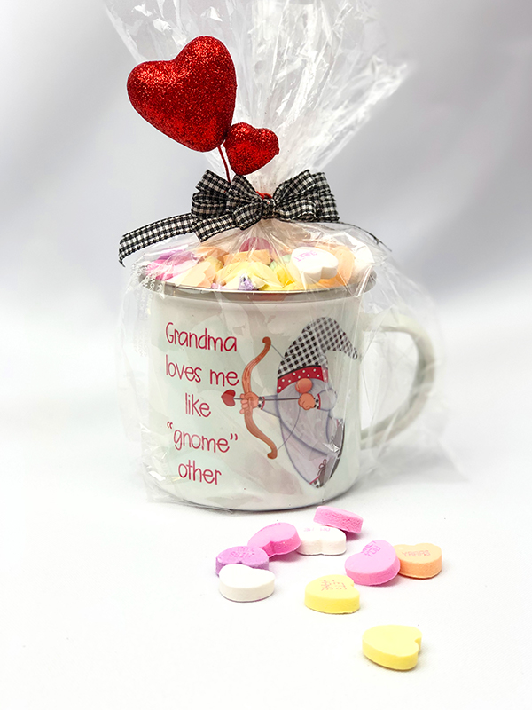 Sublimated camp cup filled with sweet treats, wrapped in cellophane, and embellished with heart