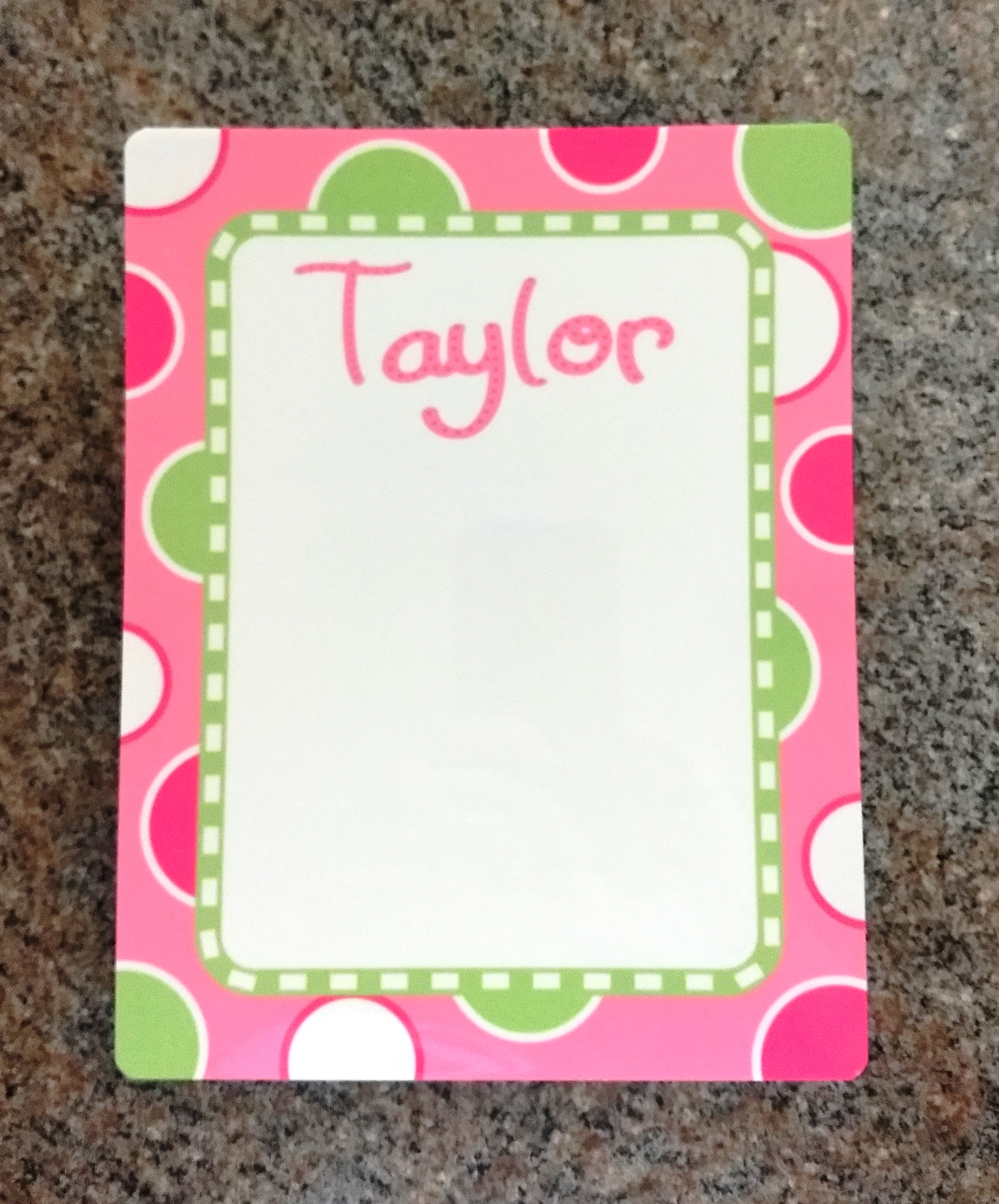 dry erase board with multi colored dots with girls name