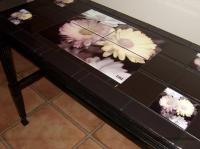 An old table we found for 3.00. Sanded, Painted. Used our own handpainted photograph for the de