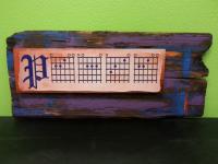 Mixed media wall art using a Chromaluxe 5x17 panel sublimated with Guitar Chords that read 