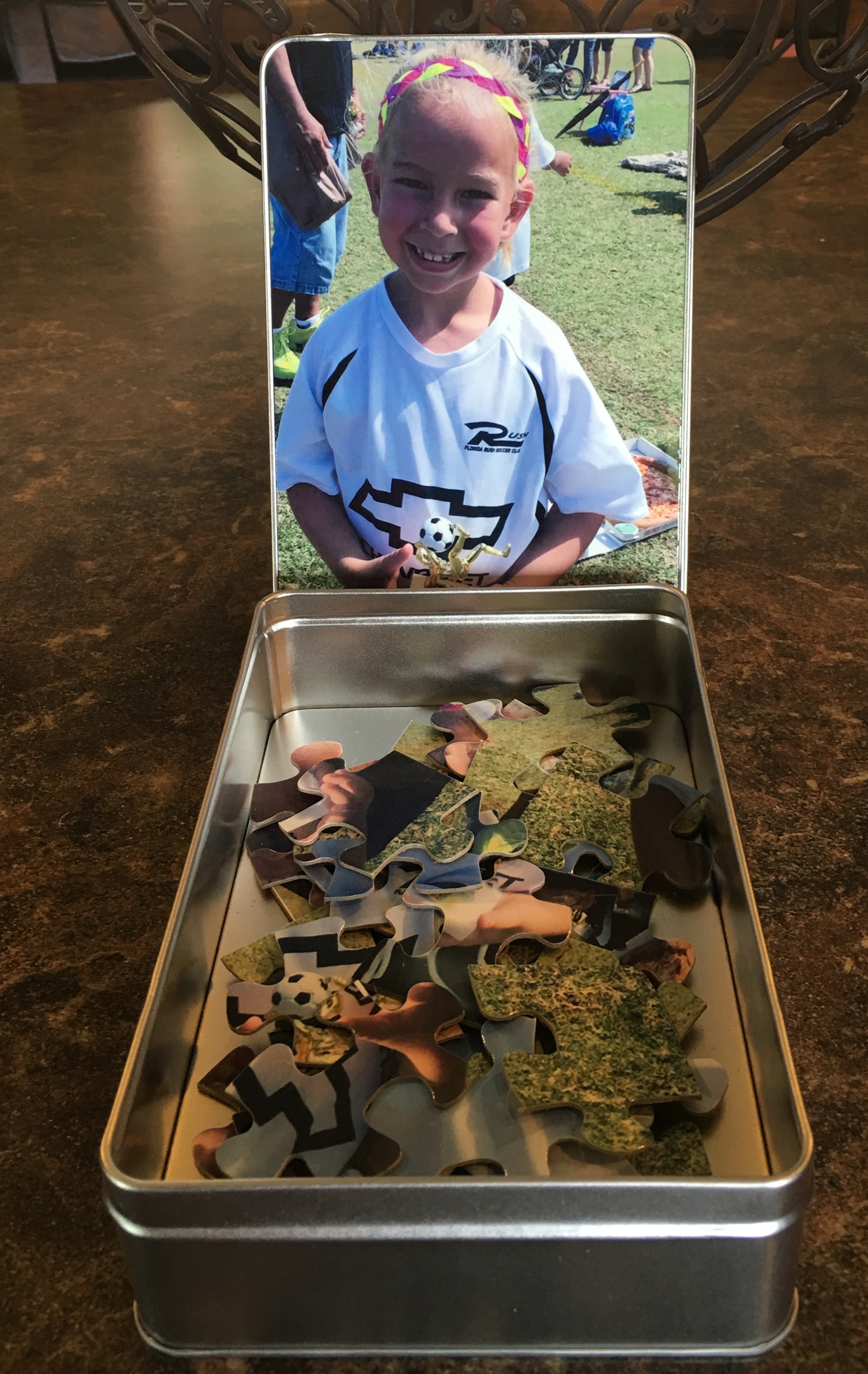 Puzzle of my granddaughter Allison with a matching tin.