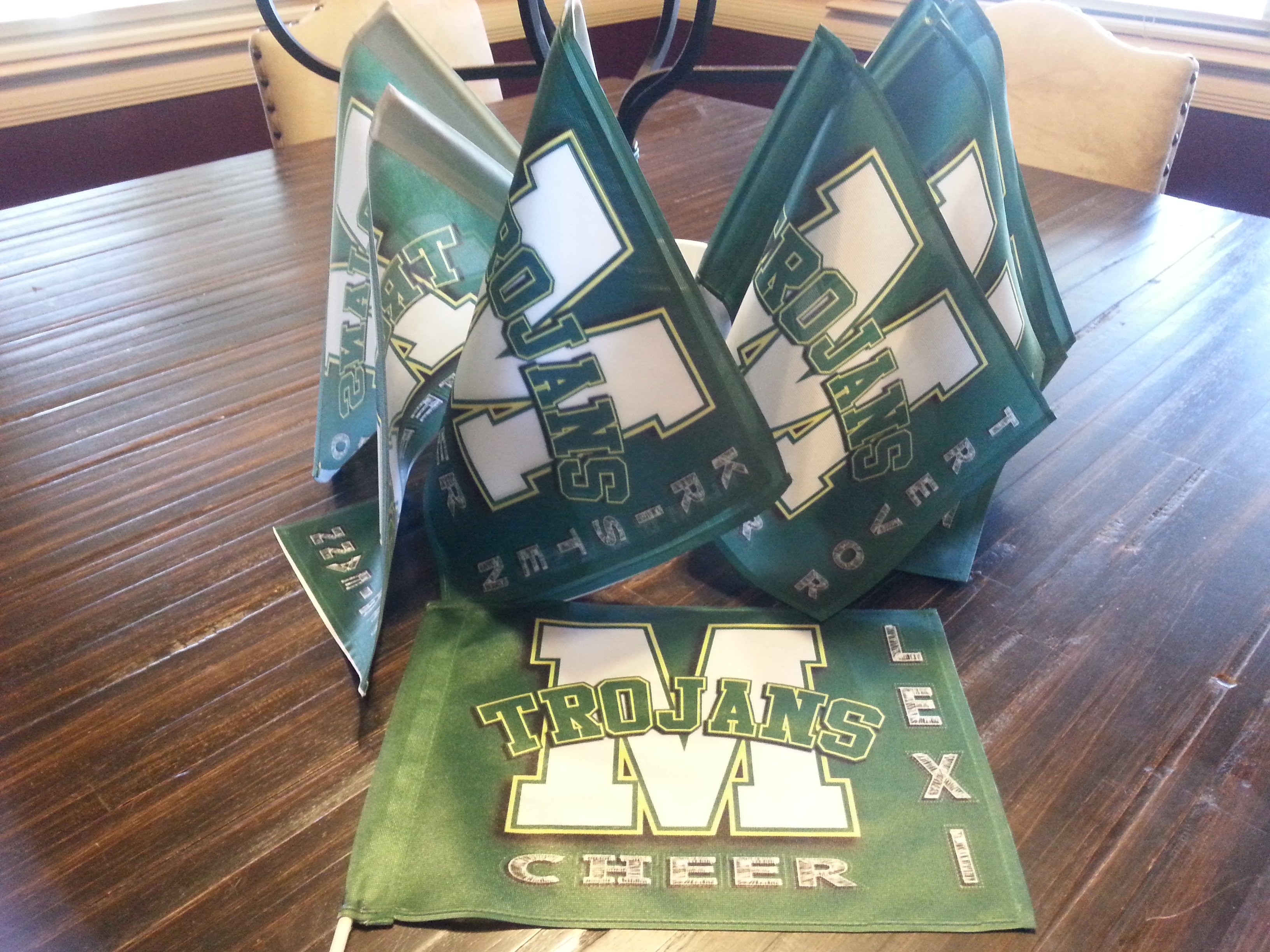 Handheld flags for parents of a High School Cheer Team used during a State Competition.