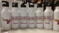 Personalized water bottles for cheerleaders. Paired with glitter decorated apparel.
