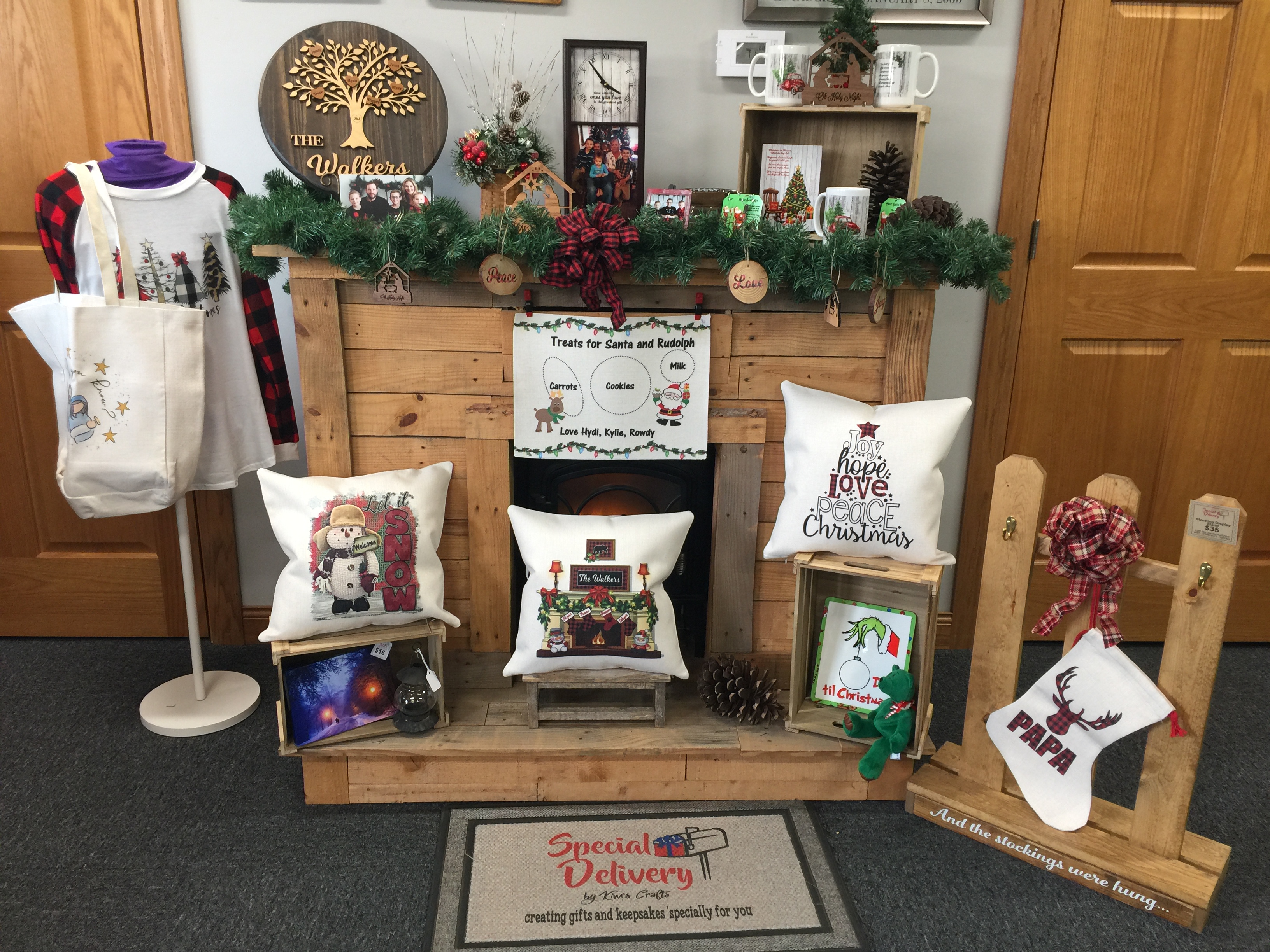 One of the Christmas displays in my shop. I have linen pillows, placemat and bag, mugs, mantle 