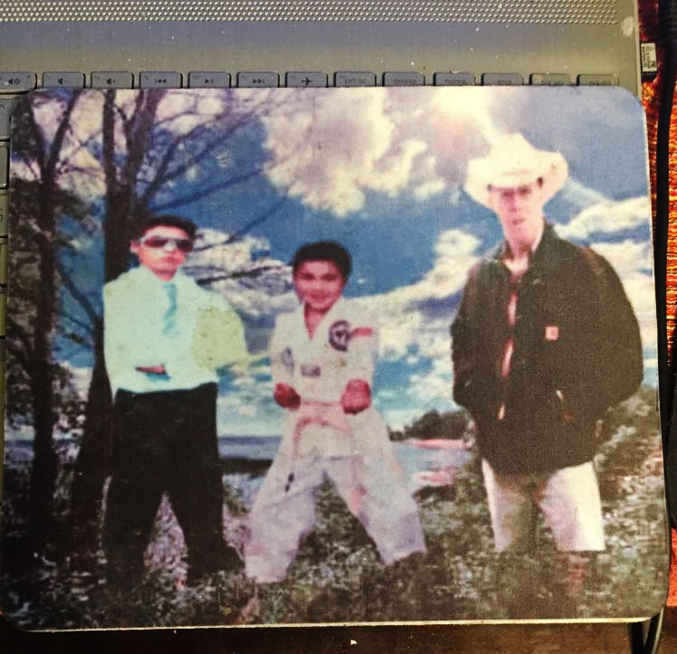 I merged photos of my 16 year old son who was murdered and my husband to create this mouse pad 