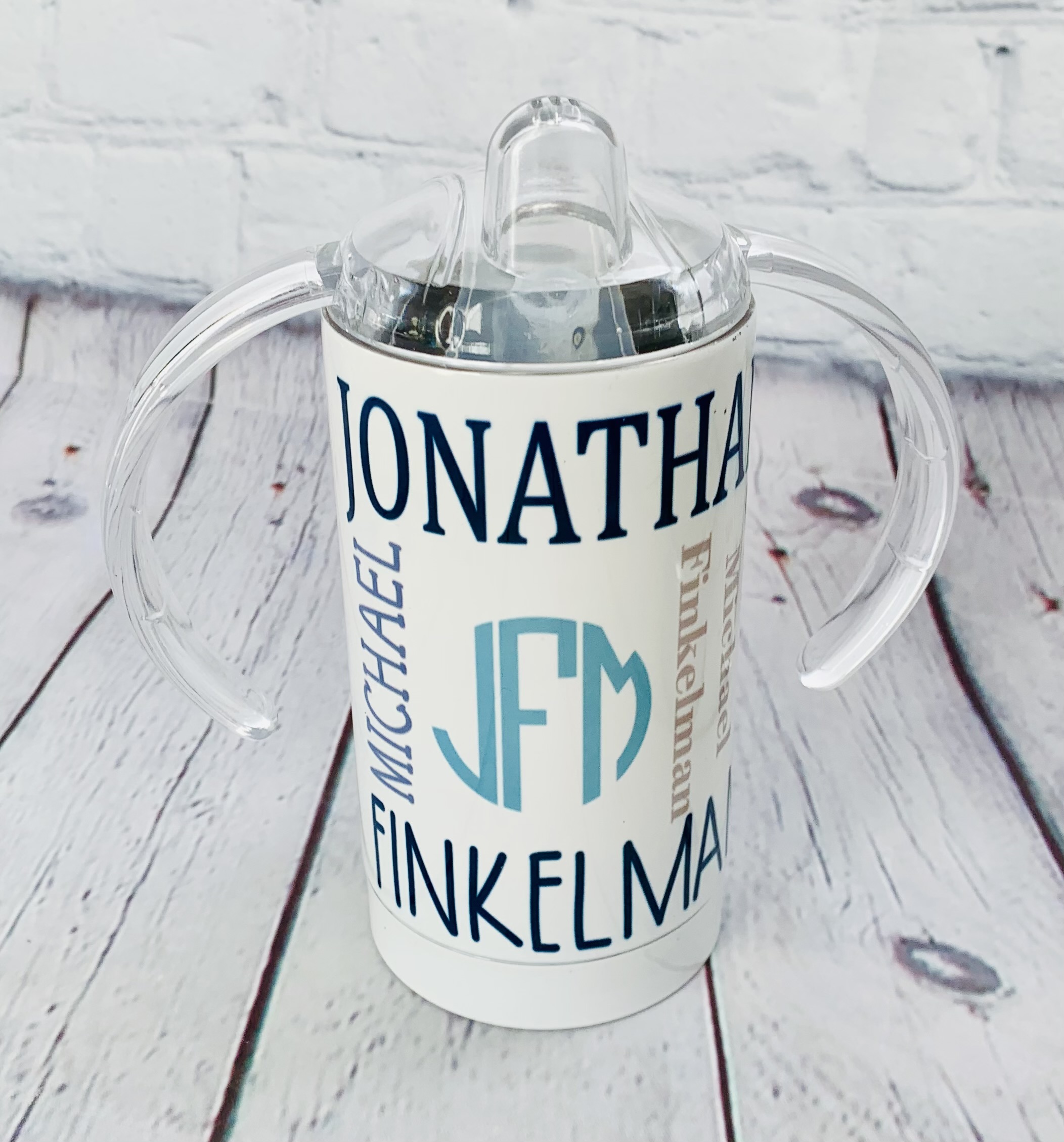 This is a fun monogrammed sippy cup with the name all over design.