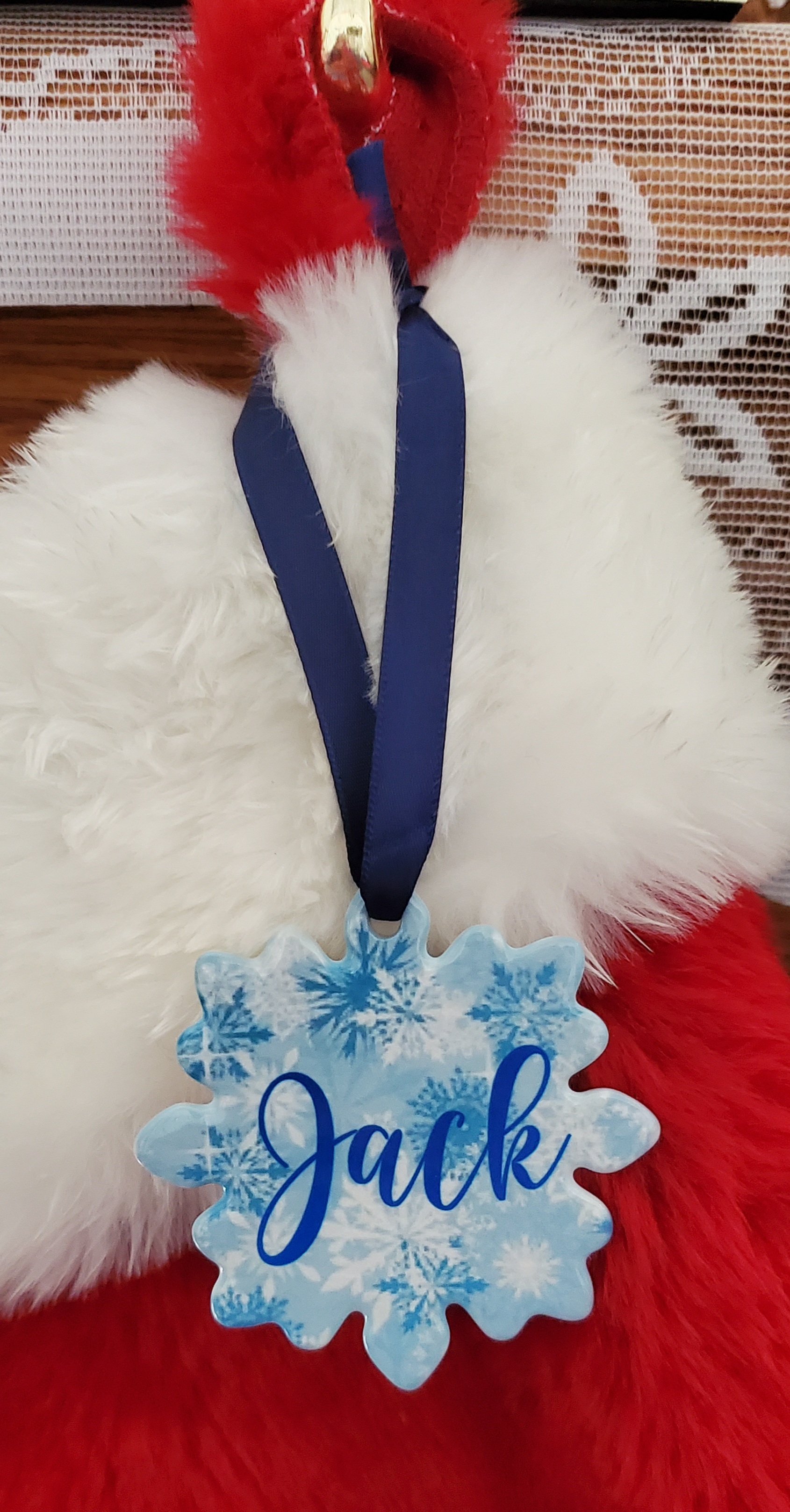 Snowflake porcelain ornament used as Christmas stocking name tag
