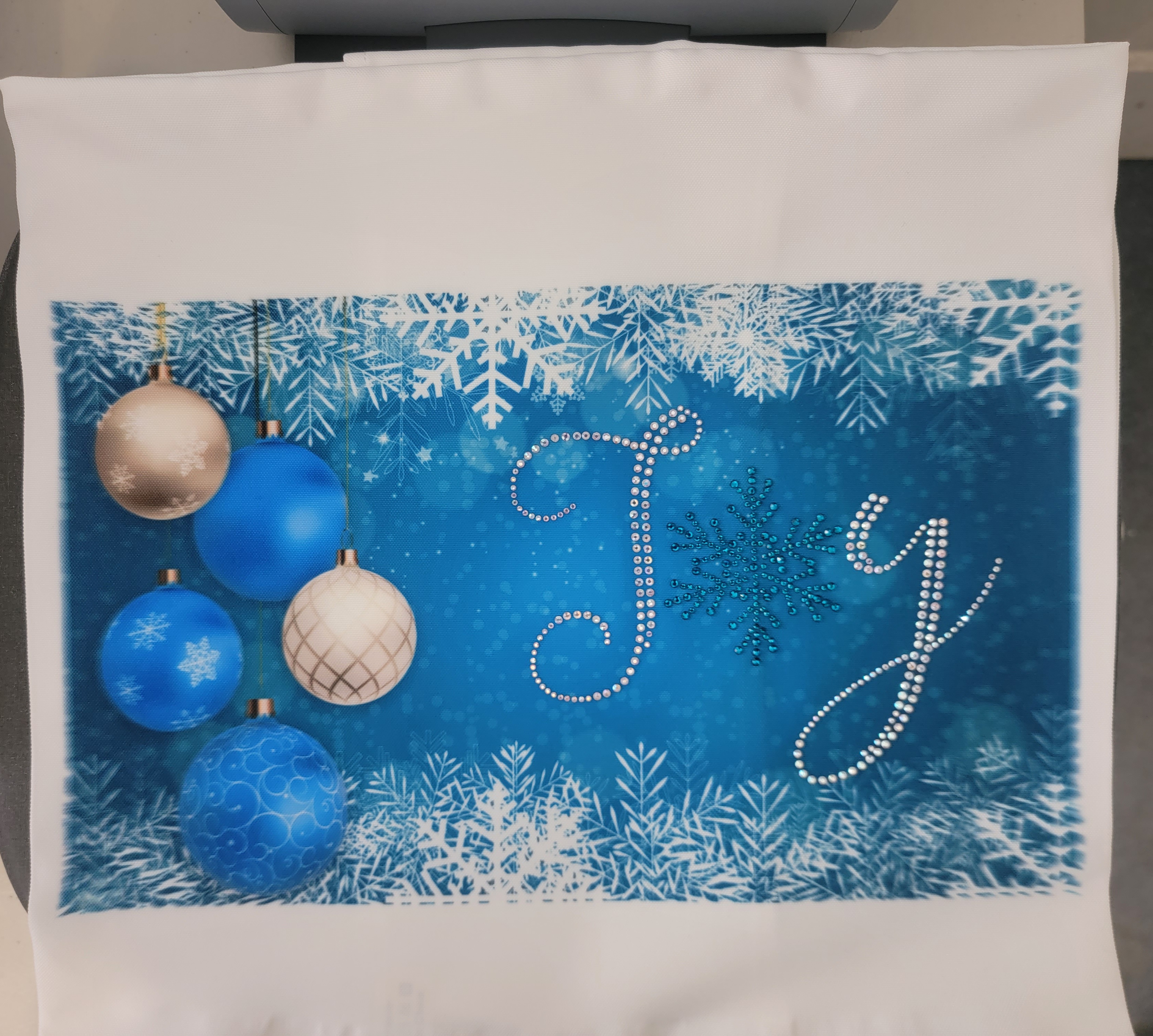 I combined sublimation and heat transfer rhinestones for a set of throw pillowcases