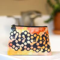 Linen cosmetic bag with watercolor background and honey bee design.