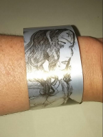 Close up of the Cuff with hand drawn pen and ink artwork