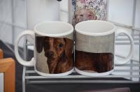 Original artwork of dachshund wrapped around entire mug.