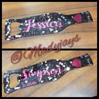 This one has a black glitter background with first name on onside, last name on other side with