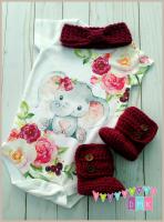 A special little one-piece with some of my crocheted goodies for our new granddaughter coming i